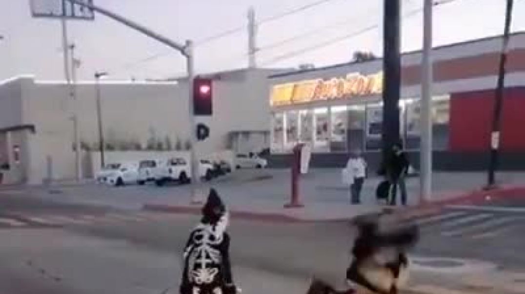 Dad does wrestling routine with son in middle of the street